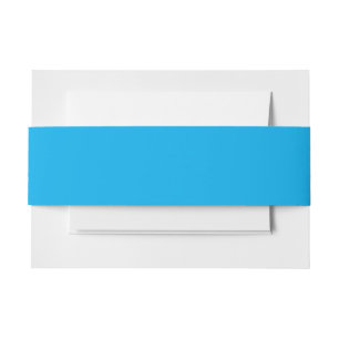 a blue sky with a plane  invitation belly band