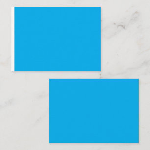 a blue sky with a plane  place card