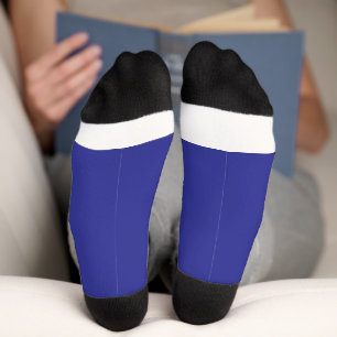 a blue wall with a clock socks