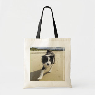 A Border Collie Dog Running On The Beach Tote Bag