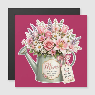 A bouquet of flowers in a watering can for mom 