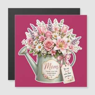 A bouquet of flowers in a watering can for mum 