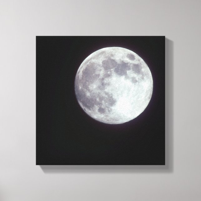 A bright full moon in a black night sky. canvas print (Front)