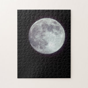 A bright full moon in a black night sky jigsaw puzzle