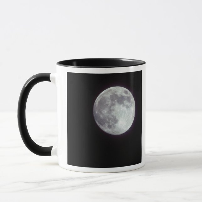 A bright full moon in a black night sky. mug (Left)