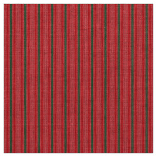 A bright red apple sits on a plain white surface. fabric