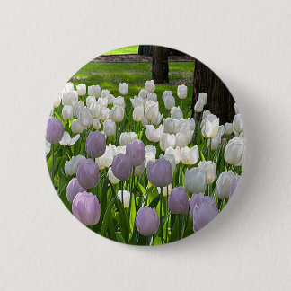 A brooch with lovely white and violet flowers. 6 cm round badge