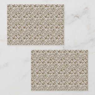 A brown rug with a geometric motif is partially co appointment card