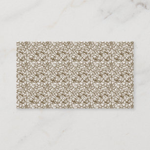 A brown rug with a geometric motif is partially co business card