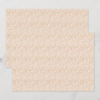 A brown rug with an intricate motif lies on the fl