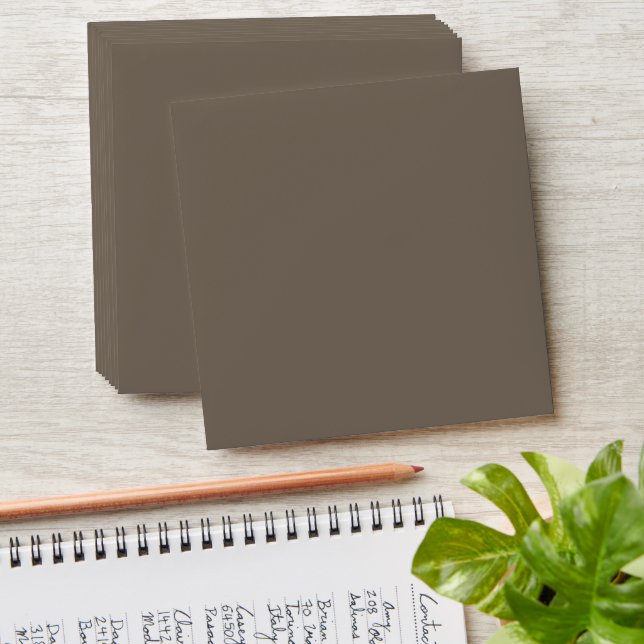 a brown wall with a black and white clock on it envelope (Stacked)
