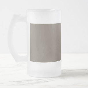 a brown wall with a black and white clock on it frosted glass beer mug