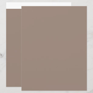 a brown wall with a clock on it