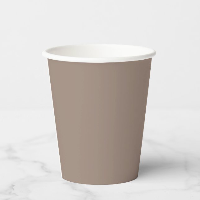 a brown wall with a clock on it paper cups (Front)
