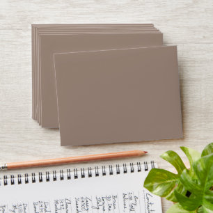 a brown wall with a envelope