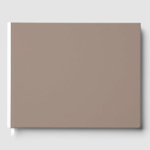 a brown wall with a guest book