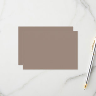a brown wall with a RSVP card