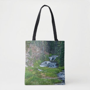 A Buck Rests at a Cascading River Tote Bag