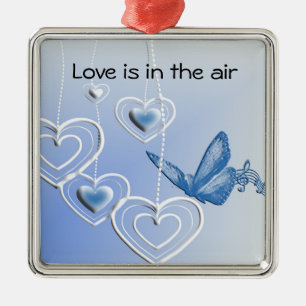 A butterfly and hearts metal tree decoration