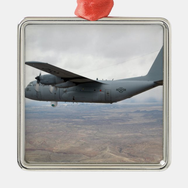 A C-130 Hercules soars through the sky Metal Tree Decoration (Front)