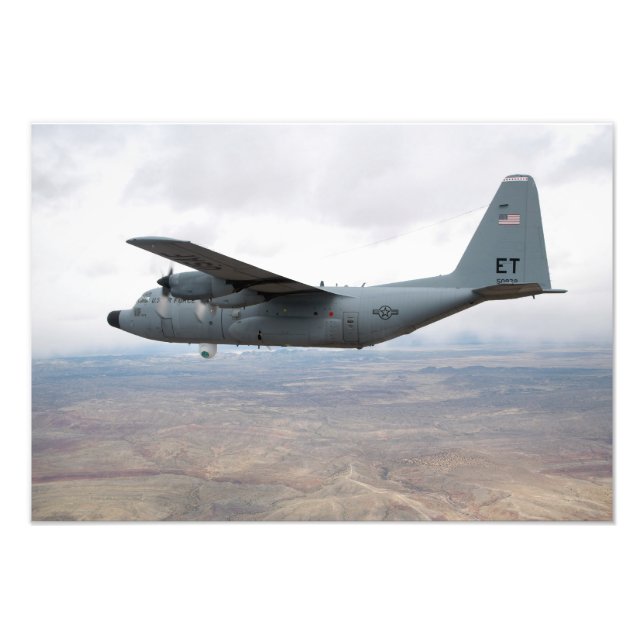 A C-130 Hercules soars through the sky Photo Print (Front)