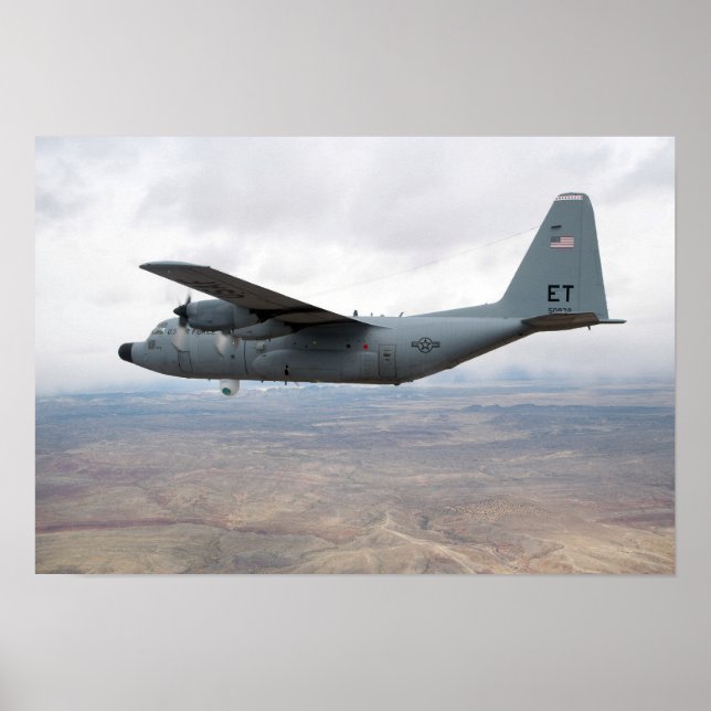 A C-130 Hercules soars through the sky Poster (Front)