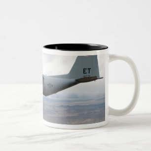 A C-130 Hercules soars through the sky Two-Tone Coffee Mug