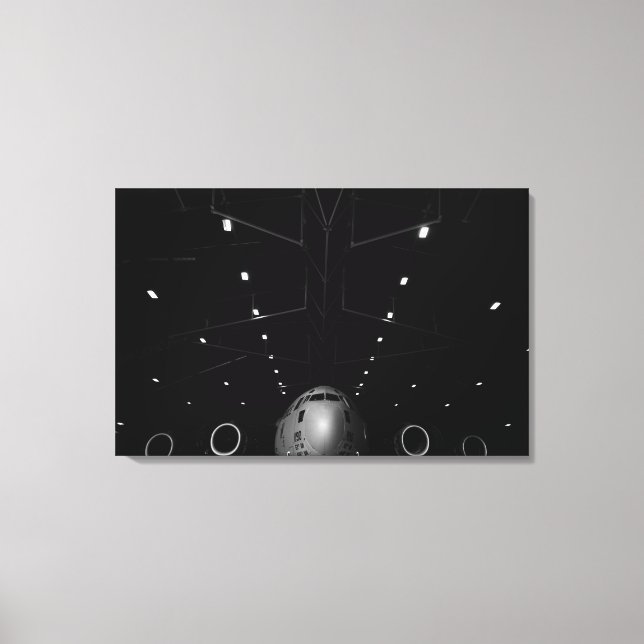A C-17 Globemaster III sits in a hangar Canvas Print (Front)
