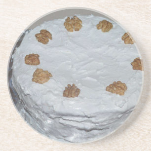 A cake with frosting coaster