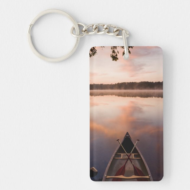 A canoe rests on the shore of Pawtuckaway Lake Key Ring (Front)