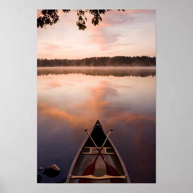 A canoe rests on the shore of Pawtuckaway Lake Poster (Front)