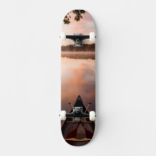 A canoe rests on the shore of Pawtuckaway Lake Skateboard
