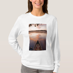 A canoe rests on the shore of Pawtuckaway Lake T-Shirt