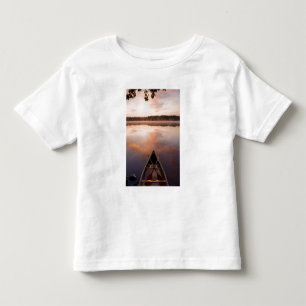 A canoe rests on the shore of Pawtuckaway Lake Toddler T-Shirt