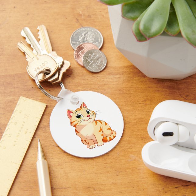 a cartoon orange tabby cat key ring (Desk)