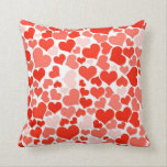 A Cascade of Love - Hearts Pattern Cushion<br><div class="desc">A pattern consisting of many different sized hearts ranging from soft seashell pink to bright fire engine red. A colourful valentines themed design. Express your love with a cute heart themed gift.</div>