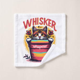 A cat peeking out from behind a flowerpot wash cloth