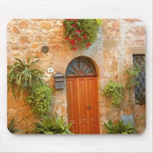 A cat seeks entrance to home in Pienza, Italy. Mouse Pad