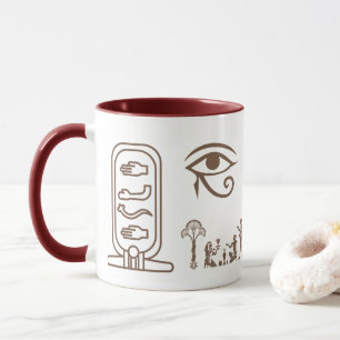 A ceramic mug with an ancient Egyptian design