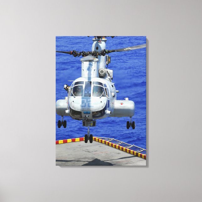 A CH-46E Sea Knight helicopter Canvas Print (Front)