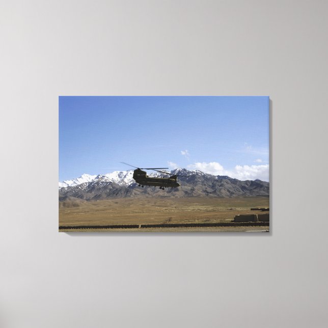 A CH-47 Chinook takes off Canvas Print (Front)