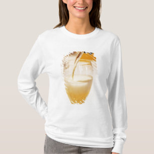 A champagne glass flute being filled with Gosset T-Shirt