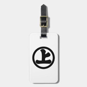 a character on a circle luggage tag