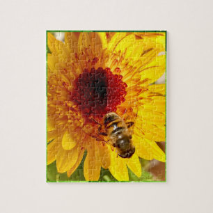 A cheerful flower with a busy bee puzzle. jigsaw puzzle