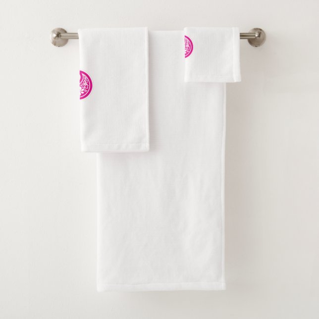 A circular logo featuring a heart symbol, embodyin bath towel set (Insitu)