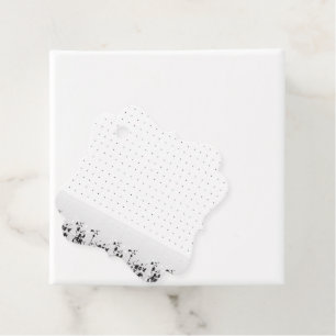A clean white backdrop featuring tiny dots scatter favour tags
