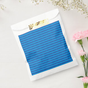 A clear blue sky stretches above a calm, deep blue favour bags