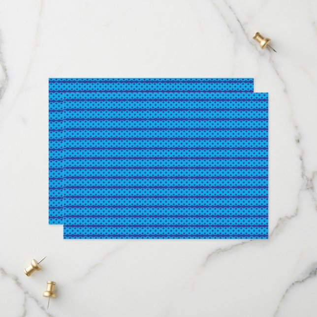 A clear blue sky stretches above a calm, deep blue save the date (Front/Back In Situ)