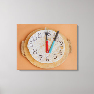 a clock made of piadina wrapped canvas print