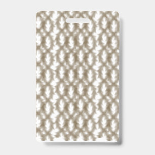 A close-up view of a crisscrossing wire mesh grid ID badge